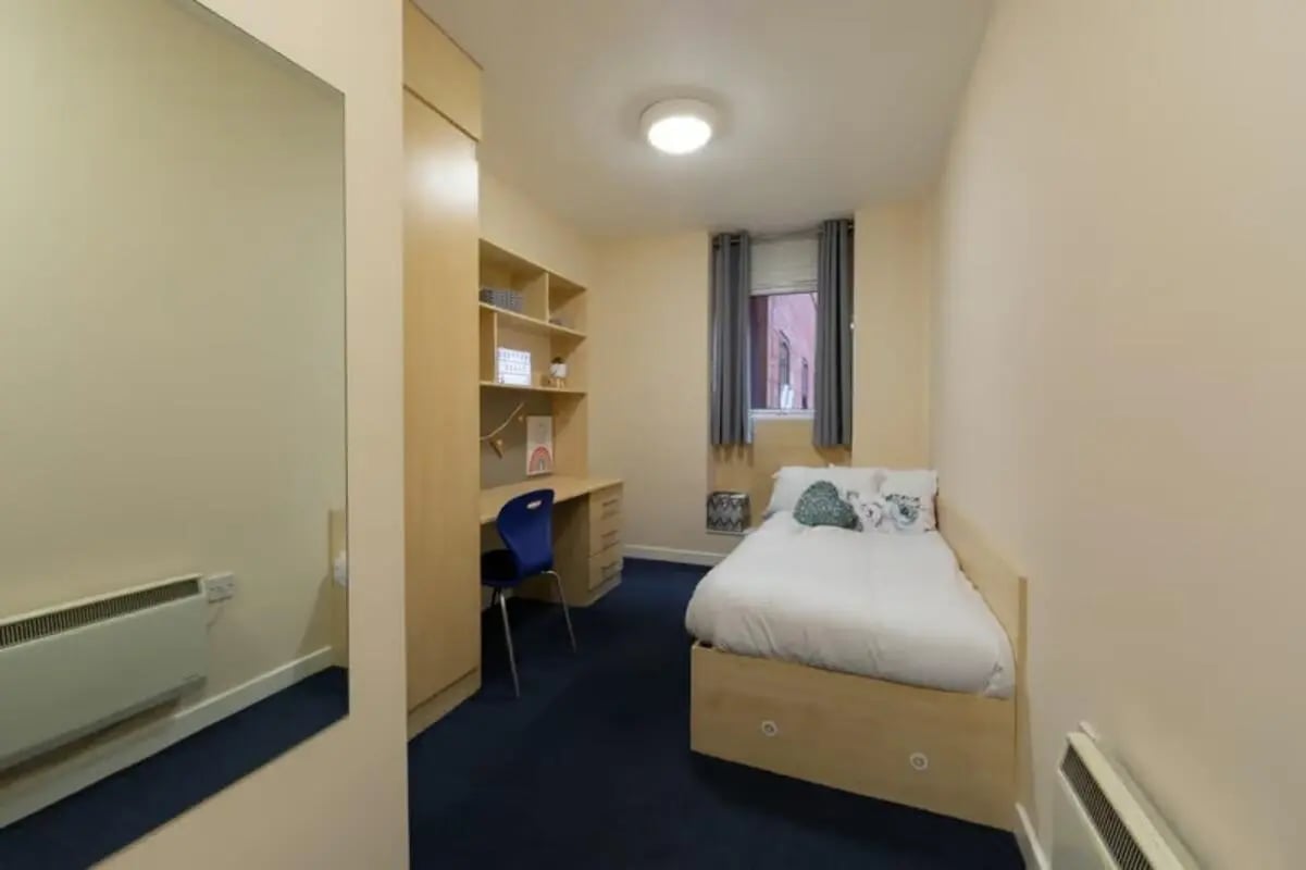 Bed desk wardrobe shelves and mirror bedroom at Brayford Quay in Lincoln Student Accommodation