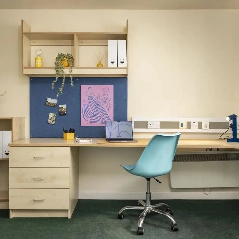 Desk with laptop chair and drawers study area at Burley Road in Leeds Student Accommodation