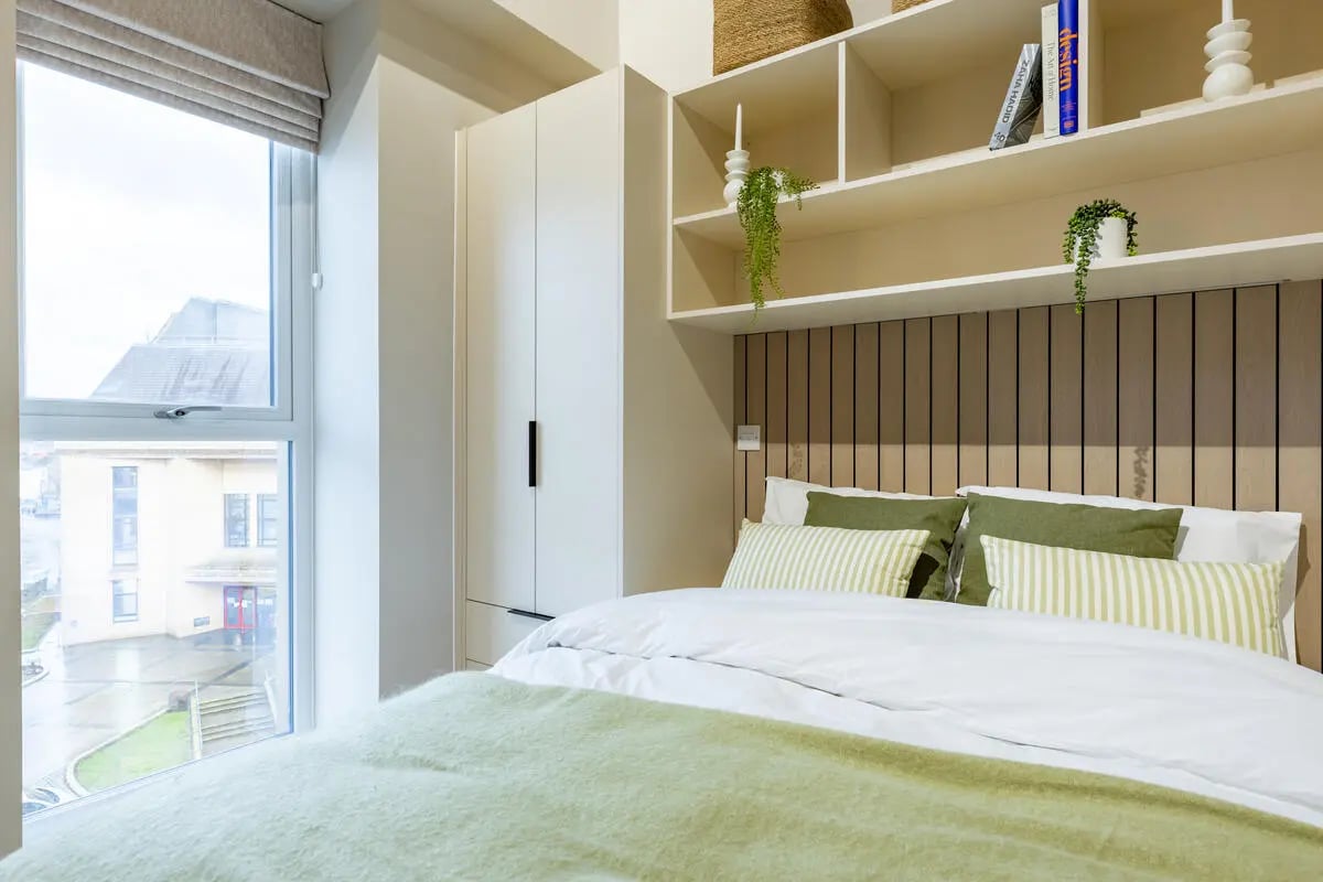 Bed wardrobe shelves and plants bedroom at Fitz and Knox in Cardiff Student Accommodation