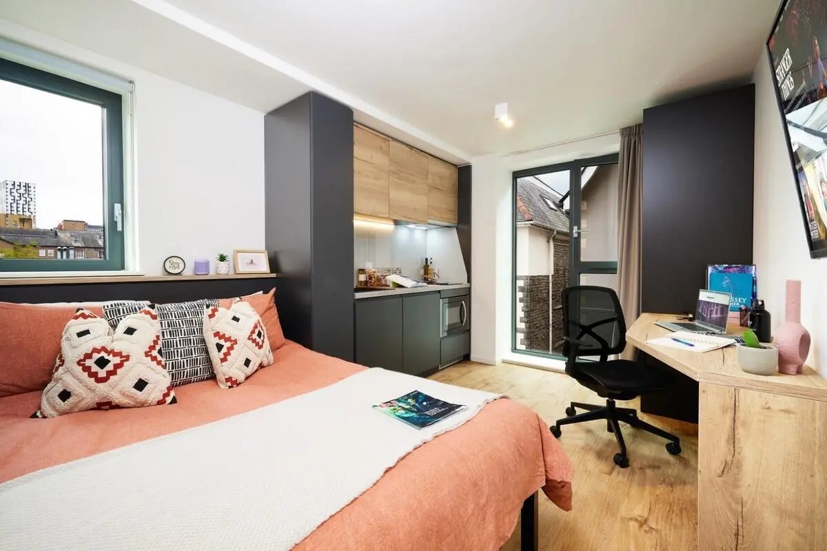 Bed kitchen desk and chair student studio at Vita Student Park Place in Cardiff Student Accommodation