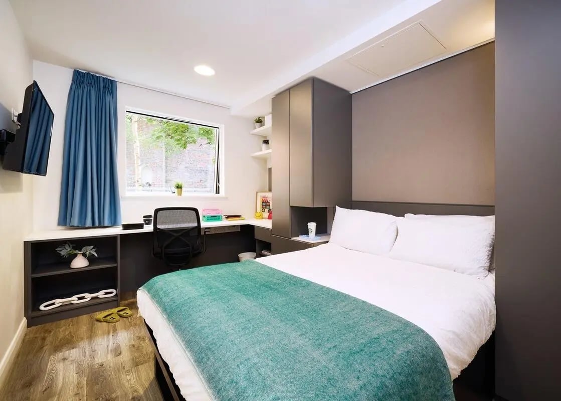 Bed desk shelving unit and television bedroom at Vita Student Lawrence Street in York Student Accommodation