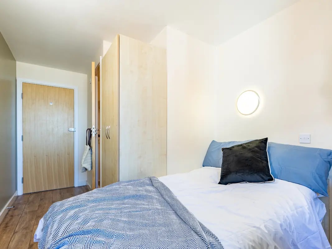 Bed with pillows and wardrobe, bedroom at Europa in Liverpool Student Accommodation