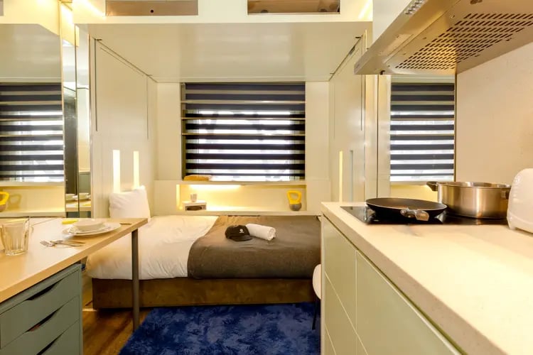 Bed kitchen desk and cooking area studio at The Stay Club - Kentish Town in London Student Accommodation