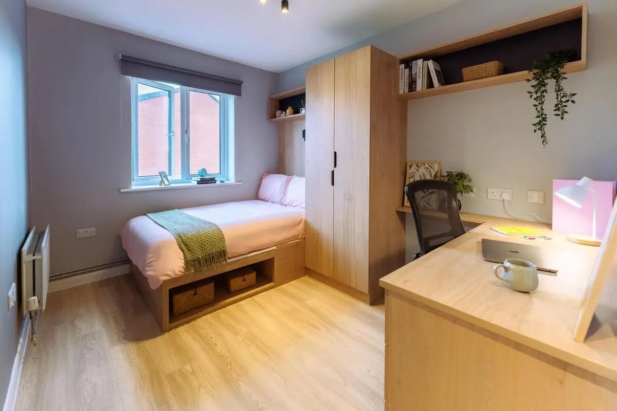 Bed wardrobe desk lamp and mug bedroom at St Peters Court in Nottingham Student Accommodation