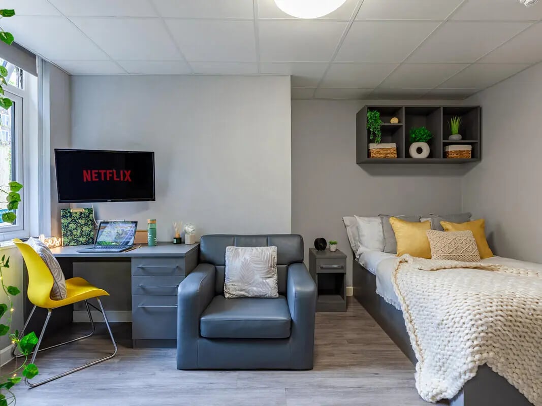 Desk chair Netflix TV bed and shelf bedroom at Allen Court in Manchester Student Accommodation