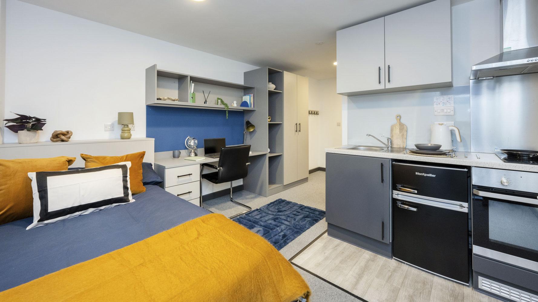 Bed desk wardrobe kitchen area studio apartment at Compass in Birmingham Student Accommodation