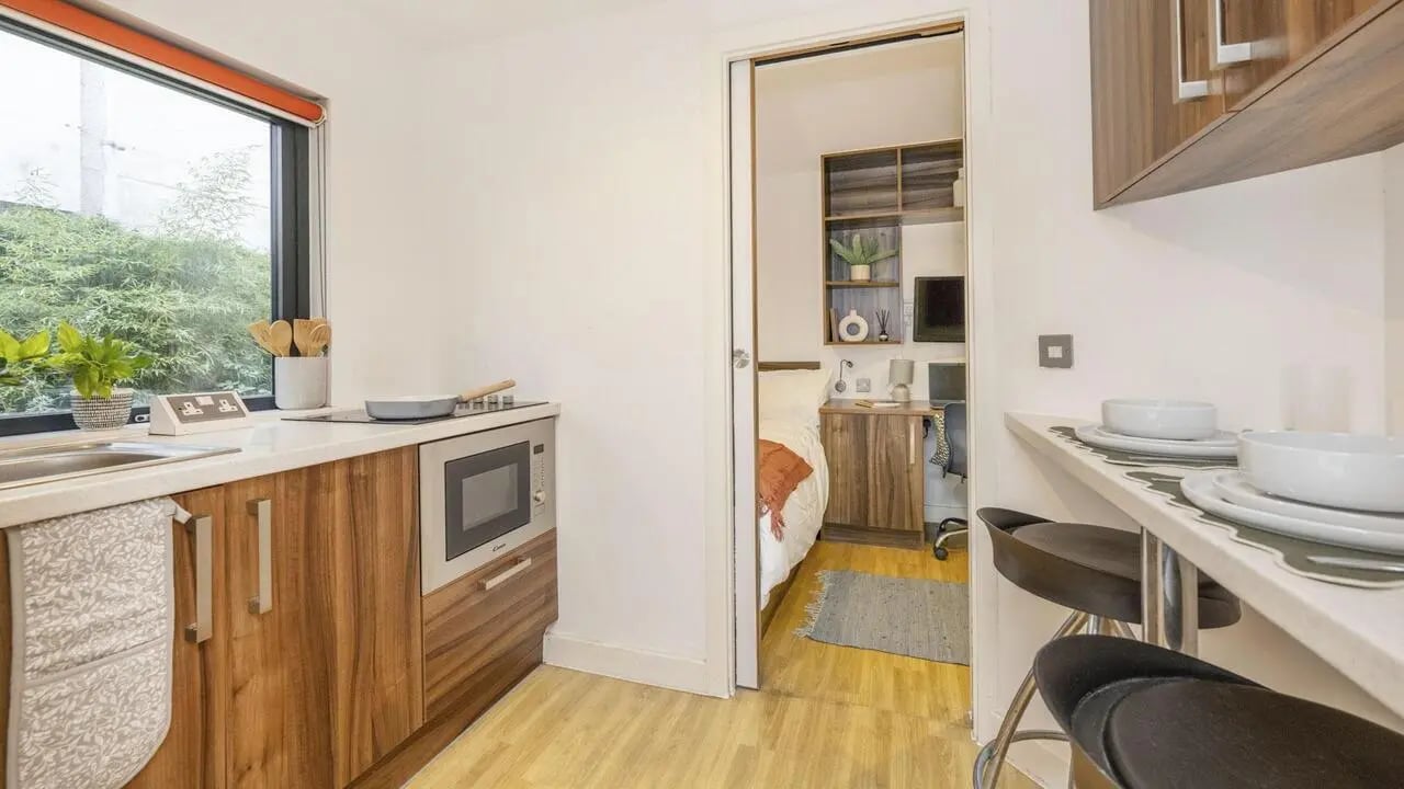 Kitchen with microwave and study bedroom living area at King Square Studios in Bristol Student Accommodation