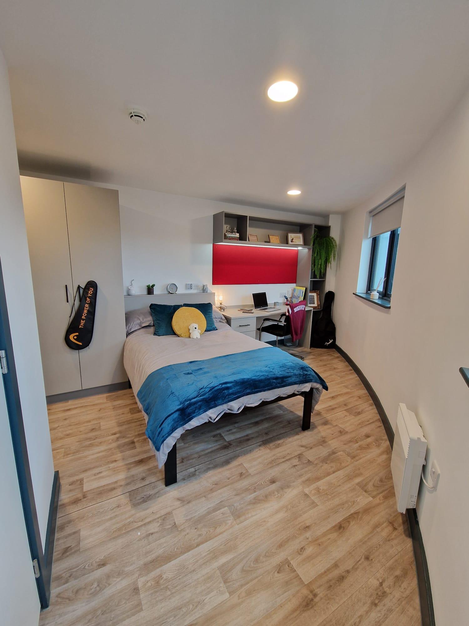 Bed desk wardrobe and guitar bedroom at Red Queen - Coventry in Coventry Student Accommodation