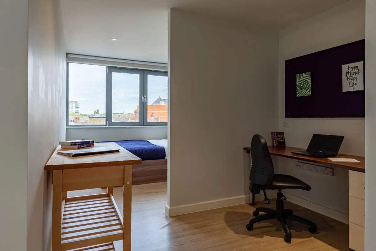 Desk with laptop and chair study area at Central Studios - London in London Student Accommodation