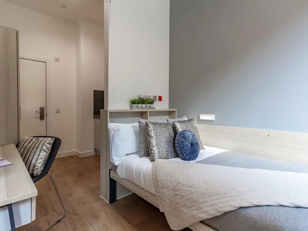 Bed desk and chair in bedroom at Straits Village in Nottingham Student Accommodation