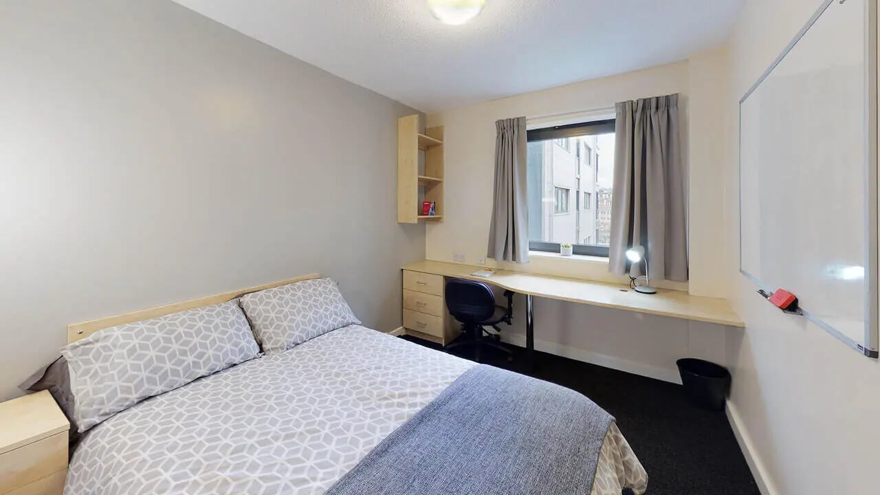 Bed desk chair shelf window whiteboard bedroom at The Pinnacles in Sheffield Student Accommodation