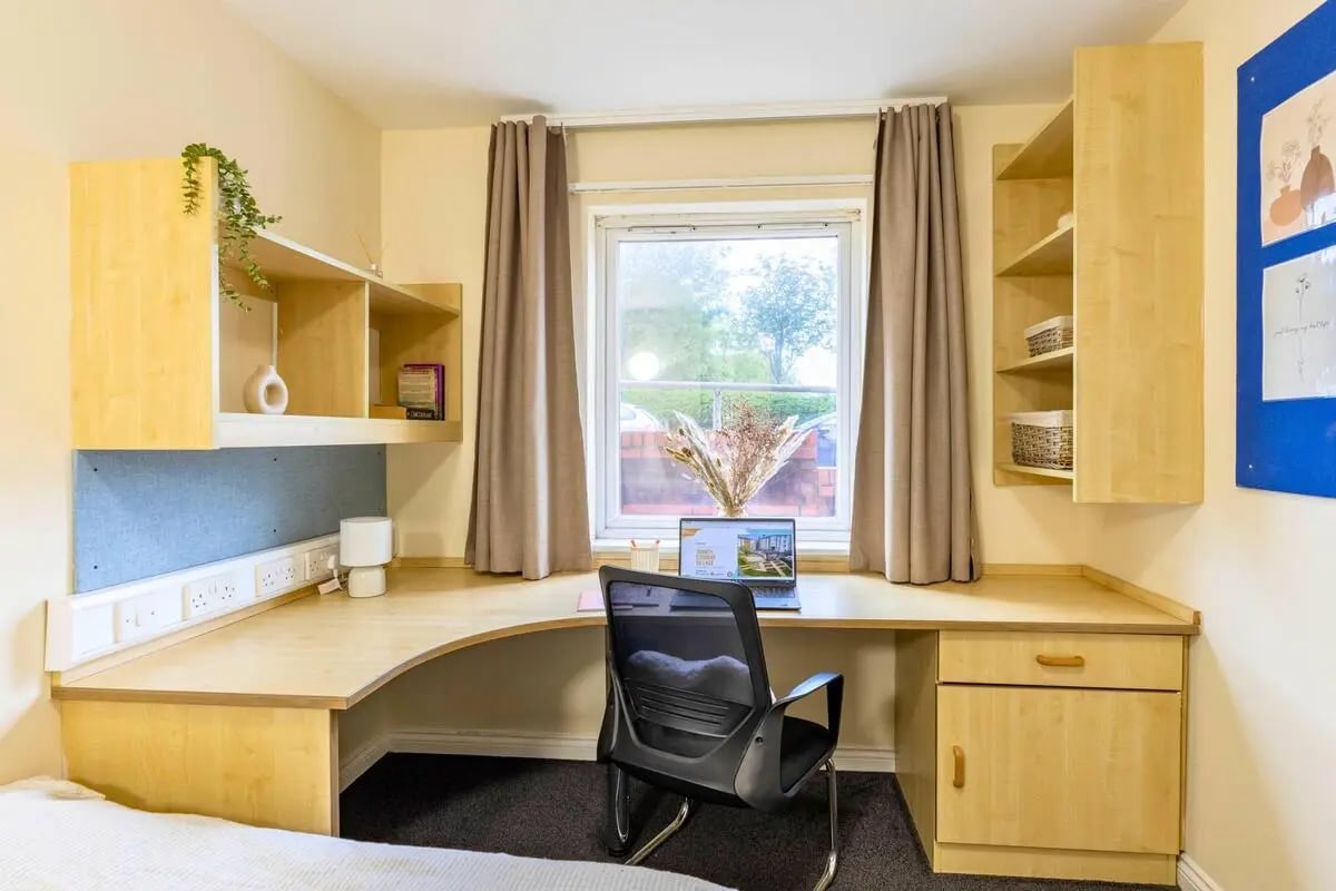 Desk chair laptop shelves window study area at Trinity Student Village in Preston Student Accommodation