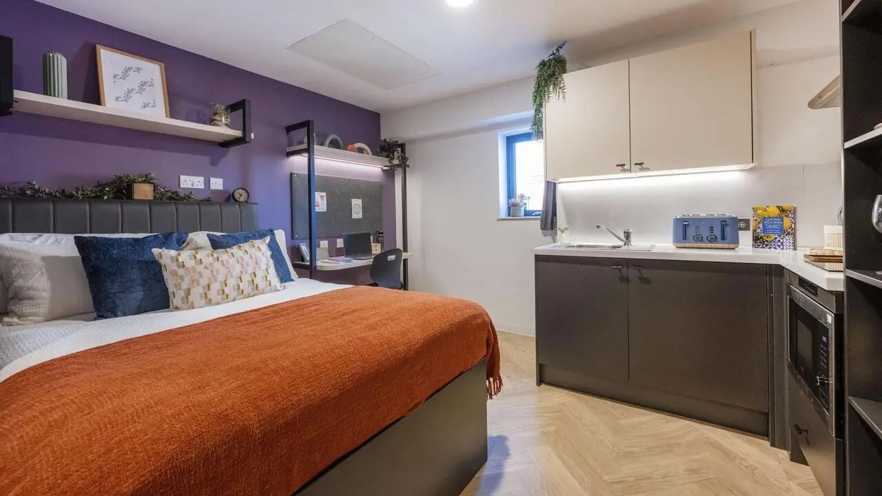Bed desk kitchen area with modern appliances studio at Arcadian in Nottingham Student Accommodation
