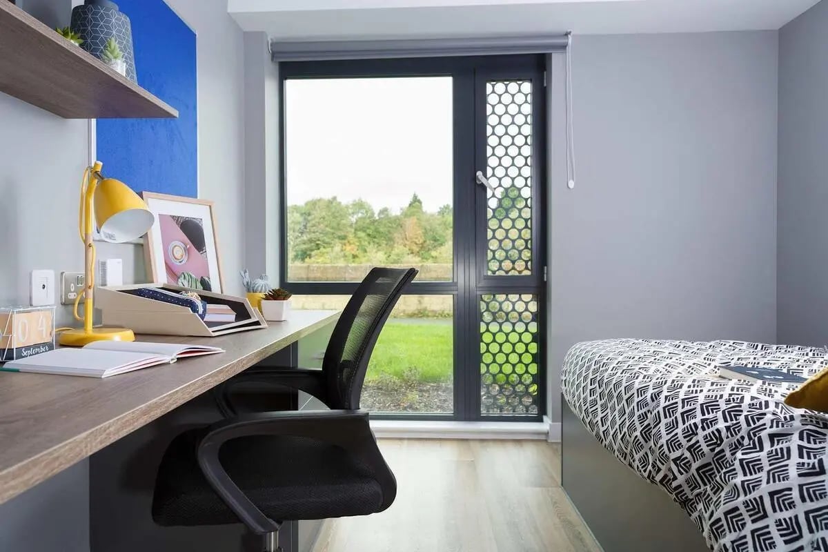 Desk chair lamp framed art bed linen bedroom at Luneside in Lancaster Student Accommodation