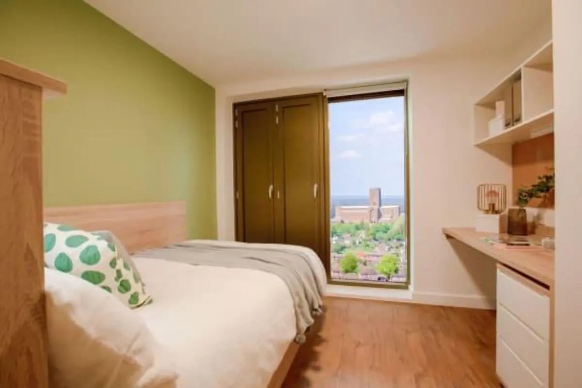 Bed pillows wardrobe desk with shelves bedroom at Bankside Student Living - Guildford in Guildford Student Accommodation