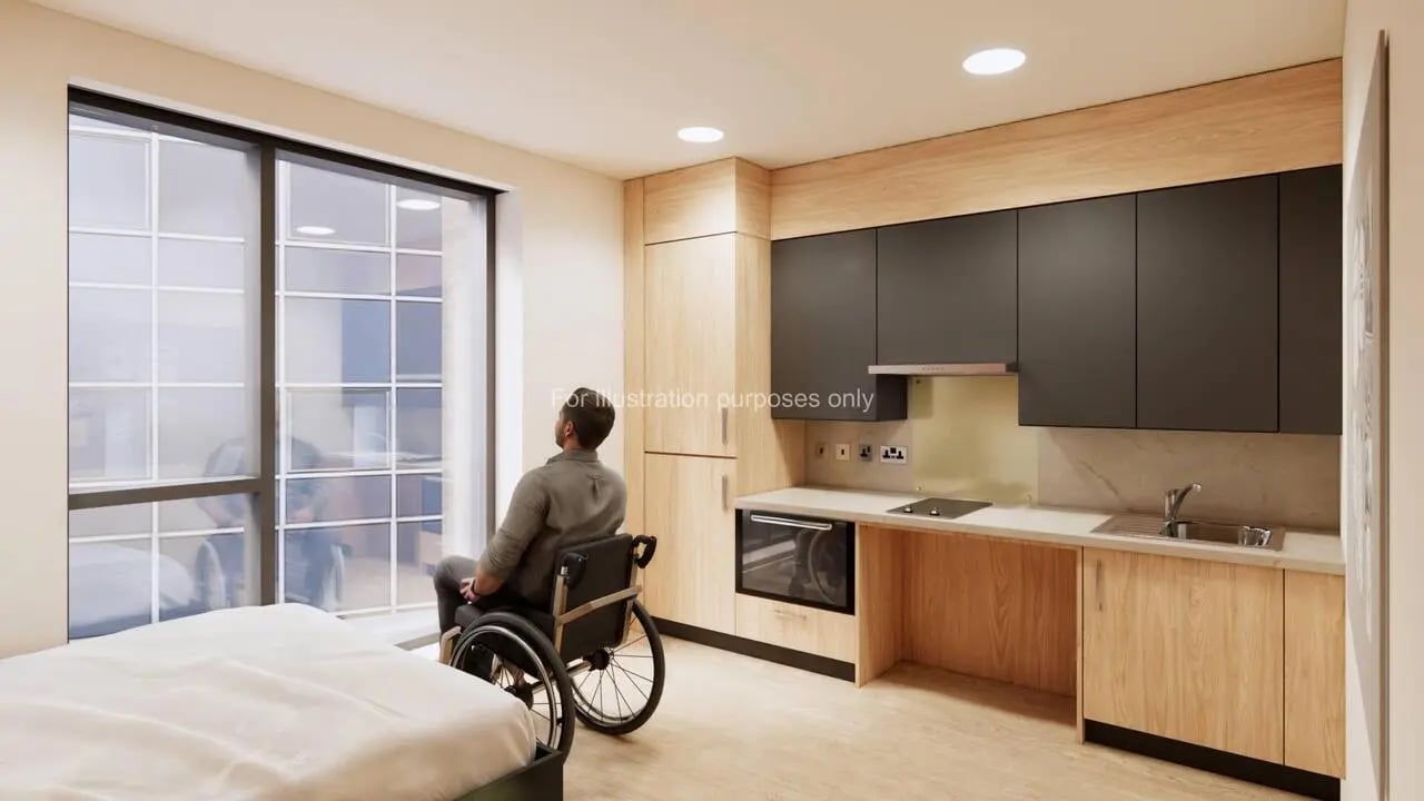 Person in wheelchair bed kitchen area bedroom at Haymarket Yards in Edinburgh Student Accommodation