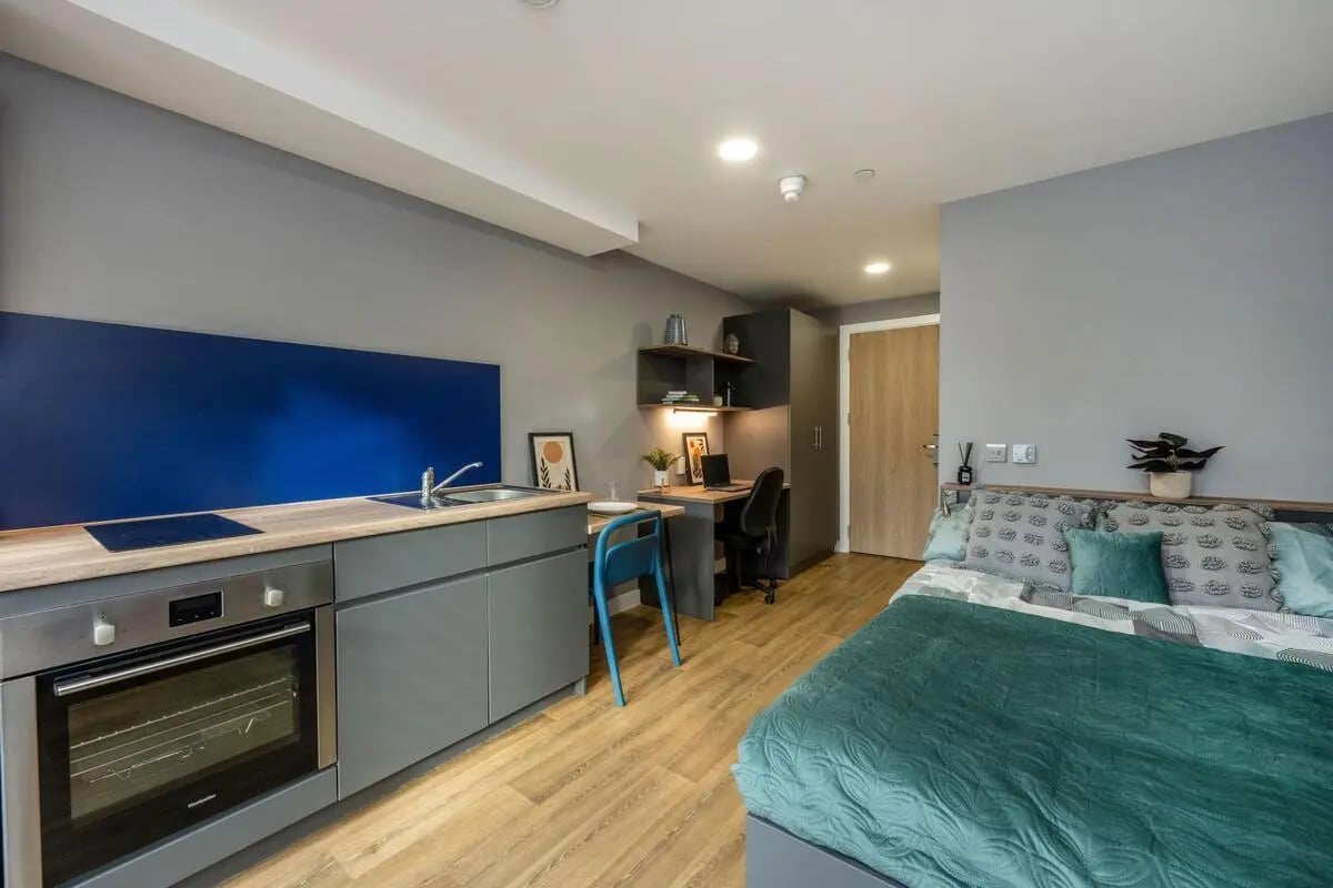 Bed desk kitchen area and oven studio apartment at Luneside in Lancaster Student Accommodation